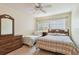 Cozy bedroom with natural light and wood furniture at 11200 102Nd Ave # 48, Seminole, FL 33778