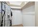 Walk-in closet featuring ample space, overhead lighting and shelving for organization at 11200 102Nd Ave # 48, Seminole, FL 33778