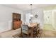 Dining area featuring a wooden table and hutch near front entrance at 11200 102Nd Ave # 48, Seminole, FL 33778