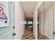 Hallway features tiled floor, mirrored closet, and view to living room at 11200 102Nd Ave # 48, Seminole, FL 33778