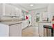 Bright kitchen with white cabinets, granite counters, and modern appliances, offering style and functionality at 11200 102Nd Ave # 48, Seminole, FL 33778