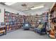 Inviting library featuring floor-to-ceiling bookshelves, comfortable armchairs, and a cozy reading space at 11200 102Nd Ave # 48, Seminole, FL 33778