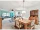 Open-concept living area with dining area and view to front entrance at 11200 102Nd Ave # 48, Seminole, FL 33778