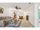 Open living room with fan, dining area, sofa, and seamless flow at 11200 102Nd Ave # 48, Seminole, FL 33778