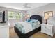 Comfortable bedroom with decorative pillows, and natural light creating a relaxing ambiance at 11485 Oakhurst Rd # 312, Largo, FL 33774