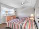 Inviting bedroom with two beds, a dresser, and soft natural light creating a cozy atmosphere at 11485 Oakhurst Rd # 312, Largo, FL 33774