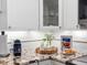 Kitchen counter featuring granite countertops, white subway tile backsplash and breakfast and coffee accoutrements at 11485 Oakhurst Rd # 312, Largo, FL 33774