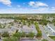 Expansive aerial view showcasing a residential community with lush greenery and neighborhood amenities at 11541 Fountainhead Dr, Tampa, FL 33626