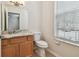 Bathroom featuring a vanity with granite countertop and updated fixtures and finishes at 11541 Fountainhead Dr, Tampa, FL 33626