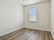 Cozy bedroom with wood floors, and a bright window at 11541 Fountainhead Dr, Tampa, FL 33626
