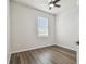 Neutral bedroom with a ceiling fan, window, and laminate floors at 11541 Fountainhead Dr, Tampa, FL 33626