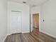 Bright bedroom with wood-look floors and a closet at 11541 Fountainhead Dr, Tampa, FL 33626
