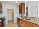 Kitchen features stainless steel appliances, granite countertops, and a view of the stairway at 11541 Fountainhead Dr, Tampa, FL 33626