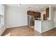 Spacious kitchen with breakfast bar, granite countertops, stainless steel appliances, and wood flooring at 11541 Fountainhead Dr, Tampa, FL 33626