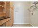 Bright laundry room with built-in shelving and cabinetry at 11541 Fountainhead Dr, Tampa, FL 33626