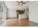 Open-concept living area with wood floors seamlessly connecting to a modern kitchen at 11541 Fountainhead Dr, Tampa, FL 33626