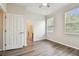 Comfortable main bedroom with wood floors, and ensuite bathroom at 11541 Fountainhead Dr, Tampa, FL 33626