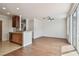 Bright room with ceiling fan, wood floors, crown moulding, and large window at 11541 Fountainhead Dr, Tampa, FL 33626