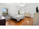 Bright bedroom featuring wood flooring, lots of natural light, and a vanity at 13015 Elm St, Odessa, FL 33556
