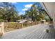 Expansive wooden deck perfect for outdoor entertaining, overlooking the spacious backyard at 13015 Elm St, Odessa, FL 33556