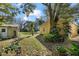 Property featuring sheds and lush greenery offering a serene and private outdoor space at 13015 Elm St, Odessa, FL 33556
