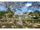 Charming single story home with a beautifully landscaped front yard and inviting brick pathway at 13015 Elm St, Odessa, FL 33556