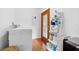 Laundry room featuring a washer, dryer, and storage shelves at 13015 Elm St, Odessa, FL 33556