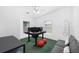 Bright home office with modern desk, two monitors, seating, and natural light at 13015 Elm St, Odessa, FL 33556