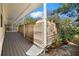 Covered porch with lattice detailing offering a tranquil space with potted plants at 13015 Elm St, Odessa, FL 33556