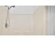 Bathroom shower featuring shower head and white walls at 13015 Elm St, Odessa, FL 33556