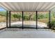 The back porch has a large fenced in yard, with brick pavers at 15124 Omaha St, Hudson, FL 34667