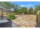 Spacious backyard with mature trees and a new wooden fence at 15124 Omaha St, Hudson, FL 34667
