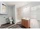 Bright bathroom featuring a walk-in shower, wood-style floors, and a vanity at 15124 Omaha St, Hudson, FL 34667