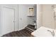 This bright bathroom shows a shower and a water heater above the toilet at 15124 Omaha St, Hudson, FL 34667