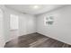 This bedroom has wood-look floors and a window to let in the sunshine at 15124 Omaha St, Hudson, FL 34667