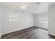 Bright bedroom featuring new flooring, neutral paint and windows with natural light at 15124 Omaha St, Hudson, FL 34667