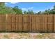 New wooden privacy fence ensuring a secure backyard at 15124 Omaha St, Hudson, FL 34667