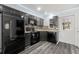 Modern kitchen with sleek appliances, stylish backsplash, and ample cabinet space at 15124 Omaha St, Hudson, FL 34667