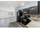 Well-appointed kitchen featuring an open design, stainless steel appliances, and granite countertops at 15124 Omaha St, Hudson, FL 34667