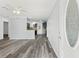 Inviting living room with durable wood-look floors offering an open concept floor plan at 15124 Omaha St, Hudson, FL 34667