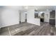 Bright and spacious living area with sleek wood-look flooring and recessed lighting at 15124 Omaha St, Hudson, FL 34667