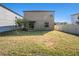 Large backyard with mature tree perfect for relaxing and entertaining at 15306 Broad Brush Dr, Sun City Center, FL 33573