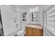 Bright bathroom features white cabinets, marble countertops, and a shower/tub combination at 15507 Avocetview Ct, Lithia, FL 33547
