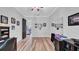 Large bedroom with a mirror wall, wood floors, and direct access to the pool at 15507 Avocetview Ct, Lithia, FL 33547