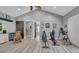 Spacious bonus room featuring high ceilings, modern flooring, and workout equipment at 15507 Avocetview Ct, Lithia, FL 33547