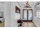 Bright foyer with hardwood floors, chandelier, and a detailed glass front door at 15507 Avocetview Ct, Lithia, FL 33547