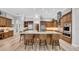 Open-concept kitchen with island, ample cabinet space, and modern appliances at 15507 Avocetview Ct, Lithia, FL 33547
