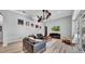 Comfortable living room featuring modern furnishings, wood floors, and bright and neutral paint at 15507 Avocetview Ct, Lithia, FL 33547