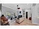 Living room featuring modern design, hardwood floors, and sliding door access to the pool at 15507 Avocetview Ct, Lithia, FL 33547