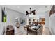 Beautiful living room flows seamlessly to the kitchen and outdoor living area with covered patio at 15507 Avocetview Ct, Lithia, FL 33547